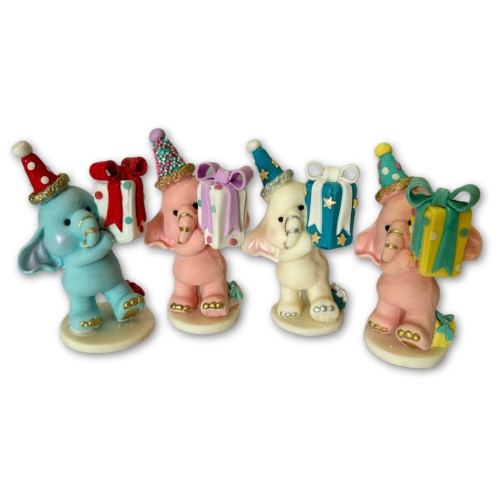 картинка Фигурка из шоколадной глазури "Слон микс 11 см" от магазина Одежда-